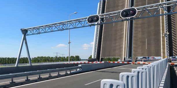 Traffic jam on a highway for an open bridge. Cars are waiting side by side for the red traffic lights.