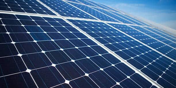 Solar panels on a sunny day against clear blue sky